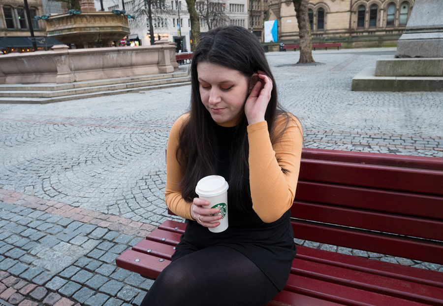 Jess Wilby sat outside Manchester town hall speaking about what if syndrome.